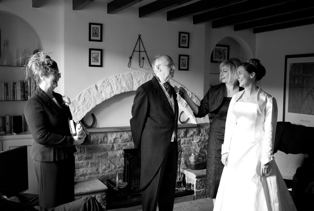 The bride and her parents gather