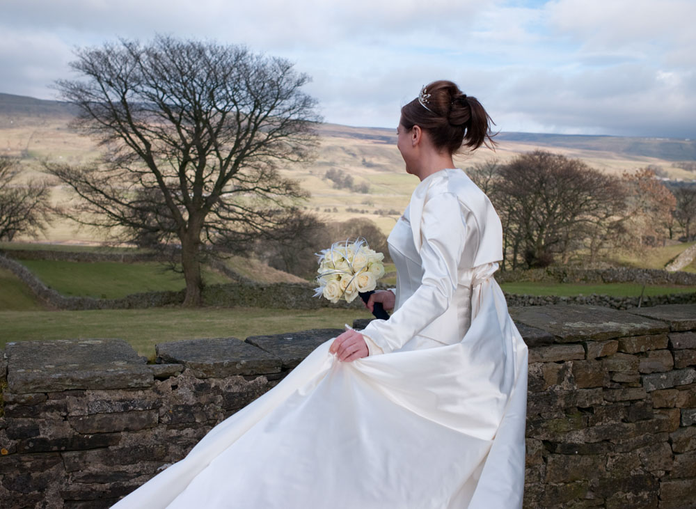 The bride in her wedding dress in beautiful February light