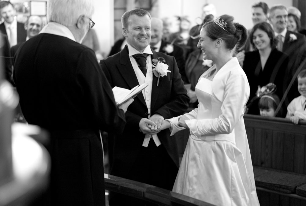 The couple with rings smile at each other at Simonstone Hall Hotel