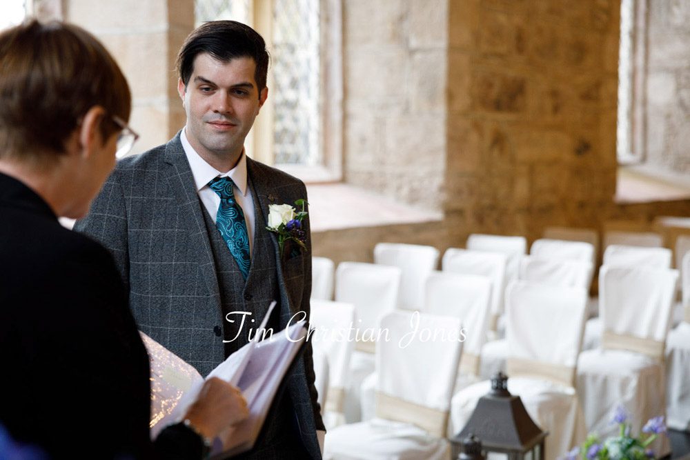 Groom sharing a moment with the registrar.