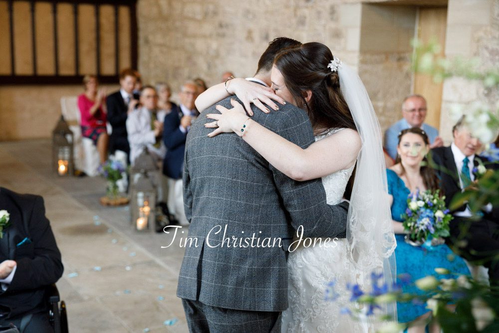 Emotional hug after ceremony during romantic Yorkshire wedding