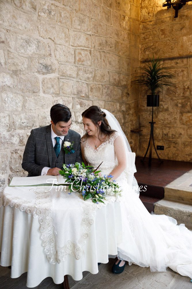 Romantic Yorkshire wedding couple at the register table