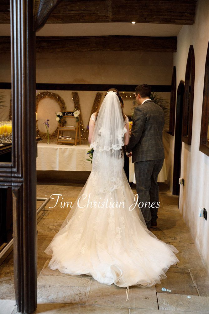 Bride’s dress train captured naturally at Barden Tower wedding