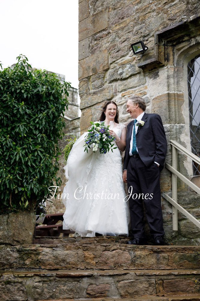 Bride and father pause at the top of the stone steps at The Priests House