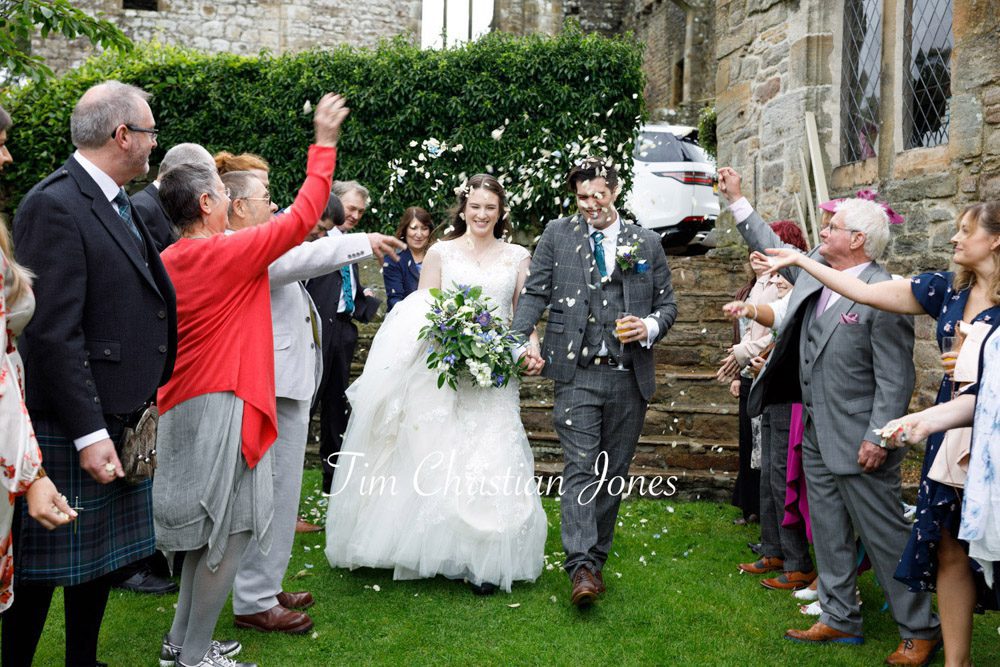 Confetti celebration for newlyweds at Barden Tower wedding
