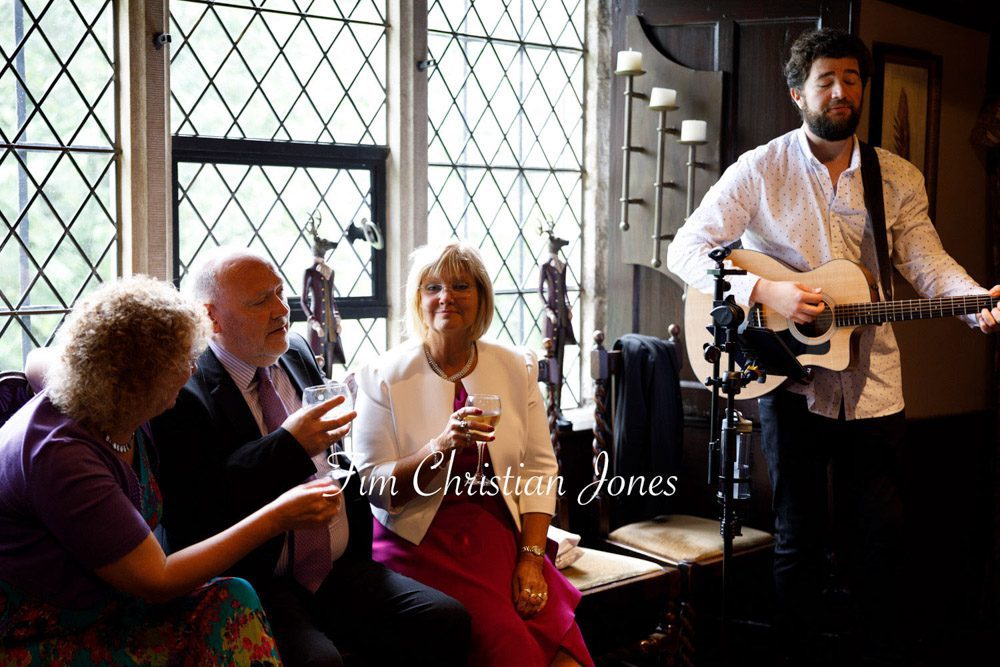 Guitarist brings relaxed atmosphere to wedding reception.