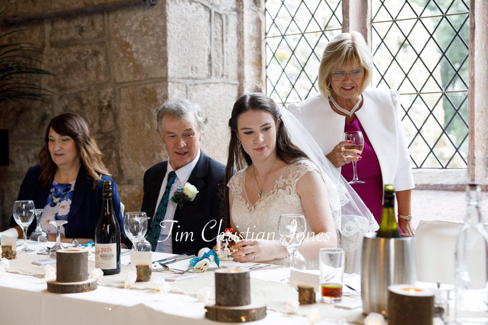Natural wedding photo of top table guests at romantic Yorkshire wedding.