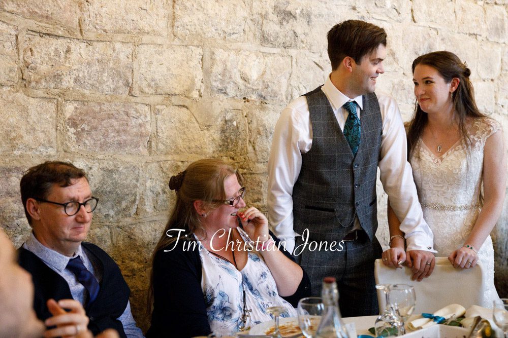 Newlyweds greet family and friends at their Yorkshire wedding.