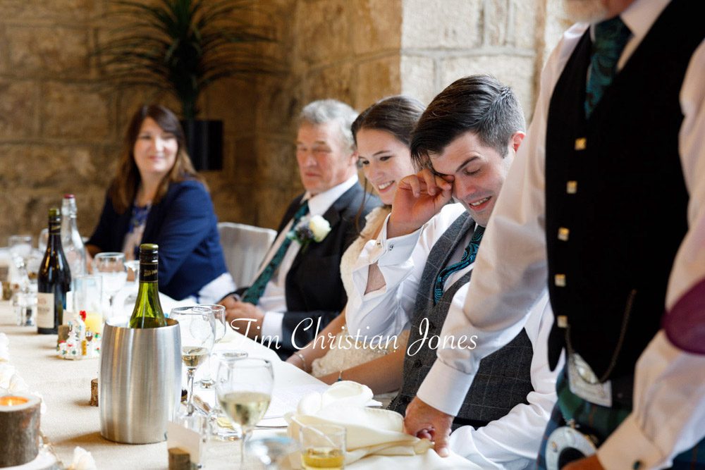 Groom's emotional reaction to father’s touching wedding speech.