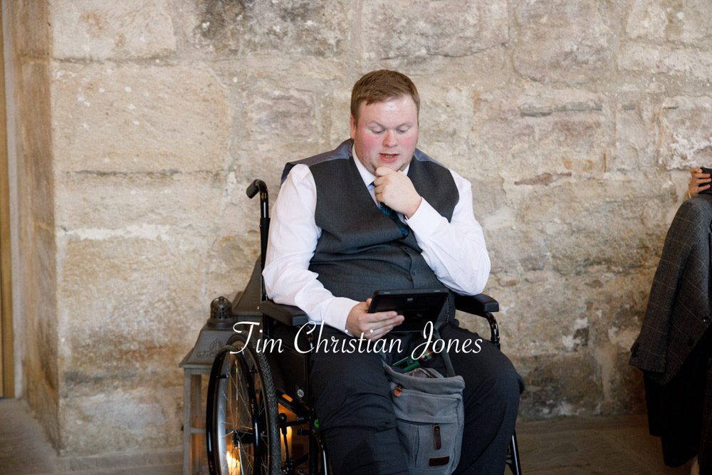 Best man giving a heartfelt speech during wedding reception.