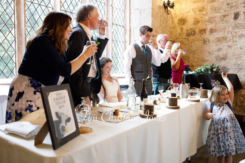 Top table guests raising a toast to the groom at The Priests House.