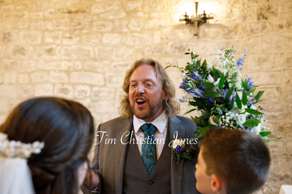 Best man chats with the bride during Yorkshire wedding at The Priests House.