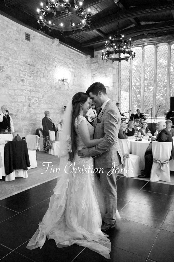 Emotional moment as newlyweds hug during first dance.